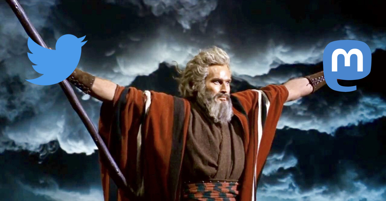 Charlton Heston as Moses holding up the Twitter and Mastodon logos.