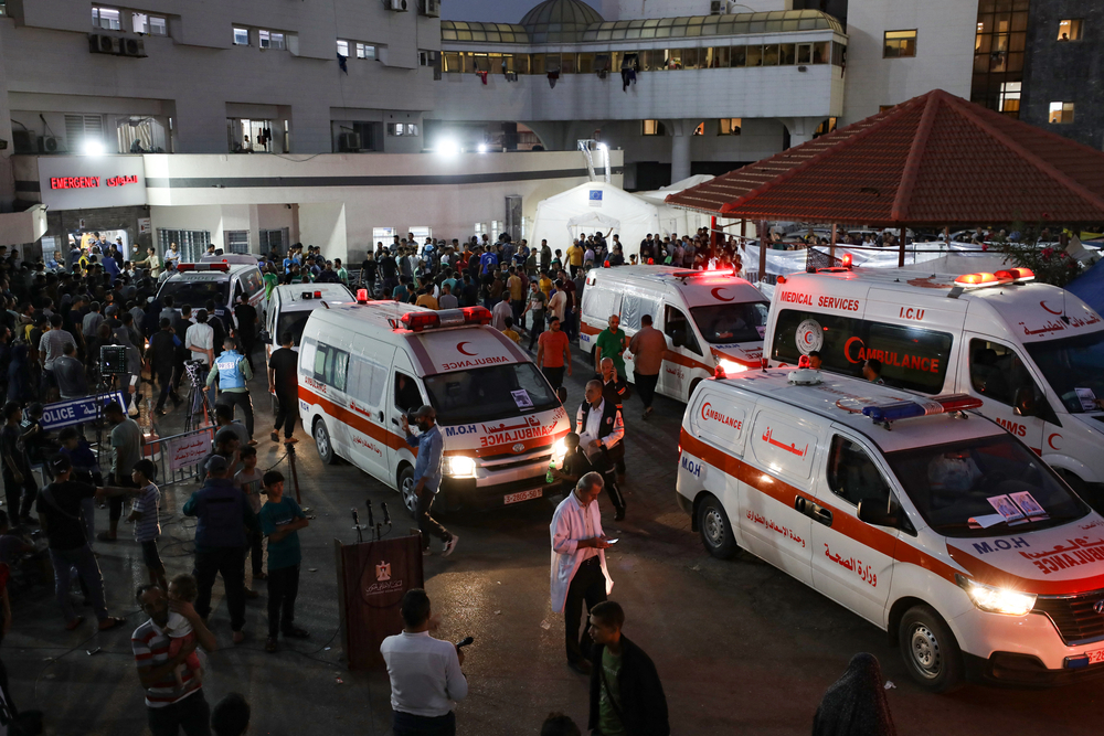 Ambulances carrying victims of Israeli strikes crowd the entrance to the emergency ward of the Al-Shifa hospital in Gaza City on October 15, 2023.